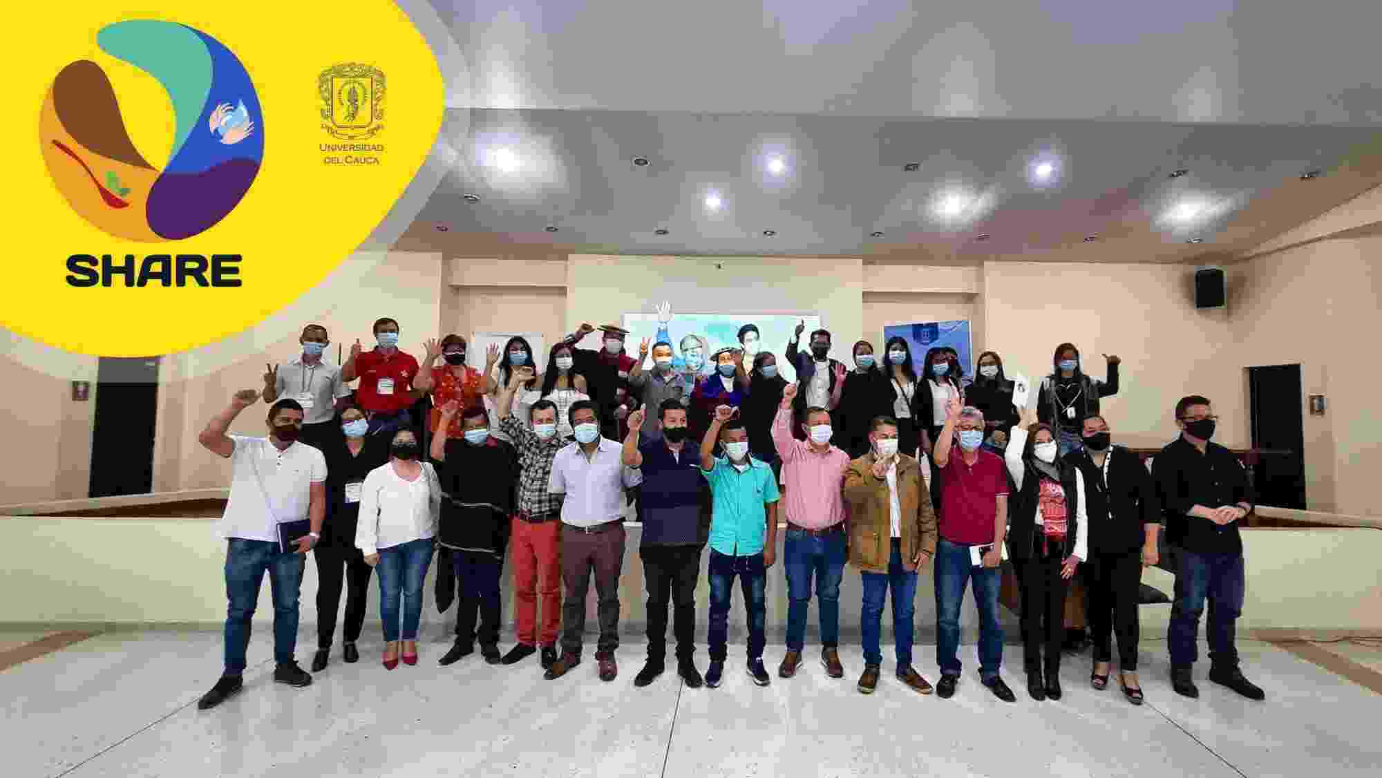 Image shows the Universidad del Cauca team grouped together, celebrating the launch of SHARE, with the project logo included on the image